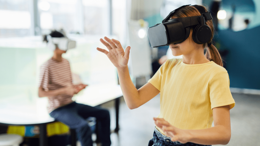 two individuals wearing virtual reality glasses in an office